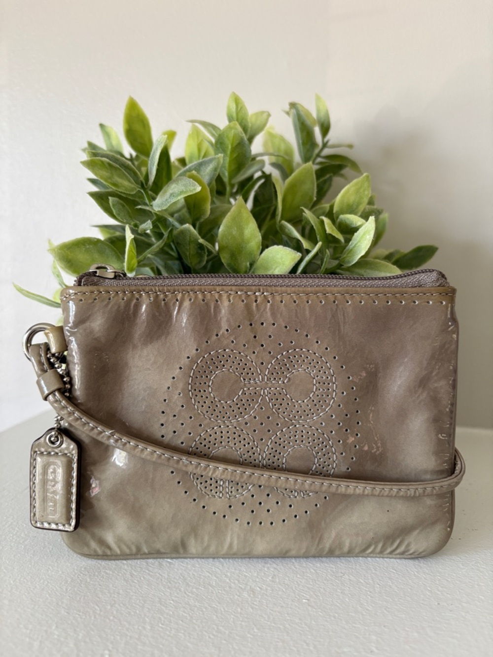 COACH Stylish Perforated Patent Leather Wristlet